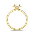 5.00 carat solitaire halo ring with a emerald cut diamond in yellow gold with round diamonds