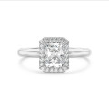 1.00 carat solitaire halo ring with a radiant cut diamond in white gold and round diamonds