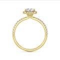 2.50 carat solitaire halo ring with a radiant cut diamond in yellow gold and round diamonds