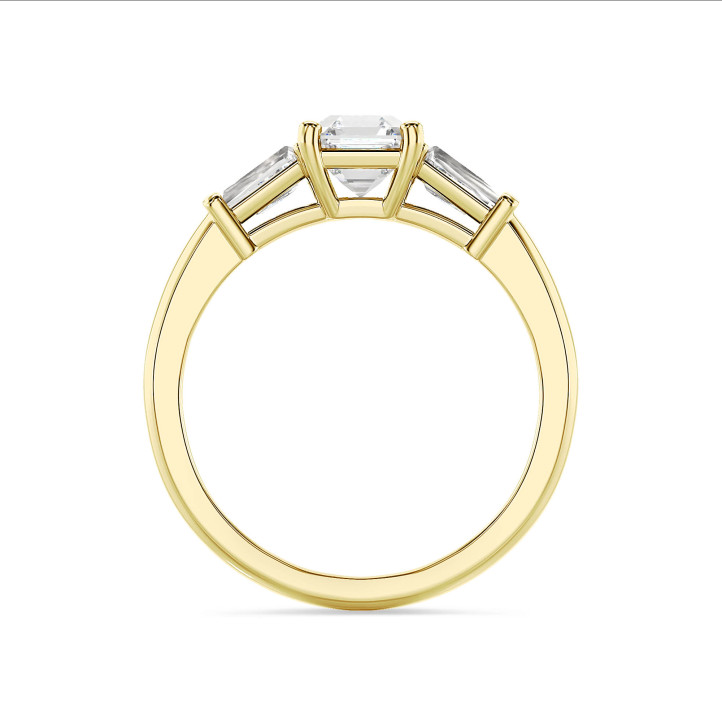 1.00 carat trilogy ring in yellow gold with a lab grown asscher cut diamond and lab grown tapered baguettes
