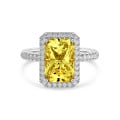 3.00 carat solitaire halo ring with a yellow radiant cut diamond in white gold