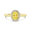 1.00 carat solitaire halo ring in yellow gold with yellow oval diamond and round diamonds