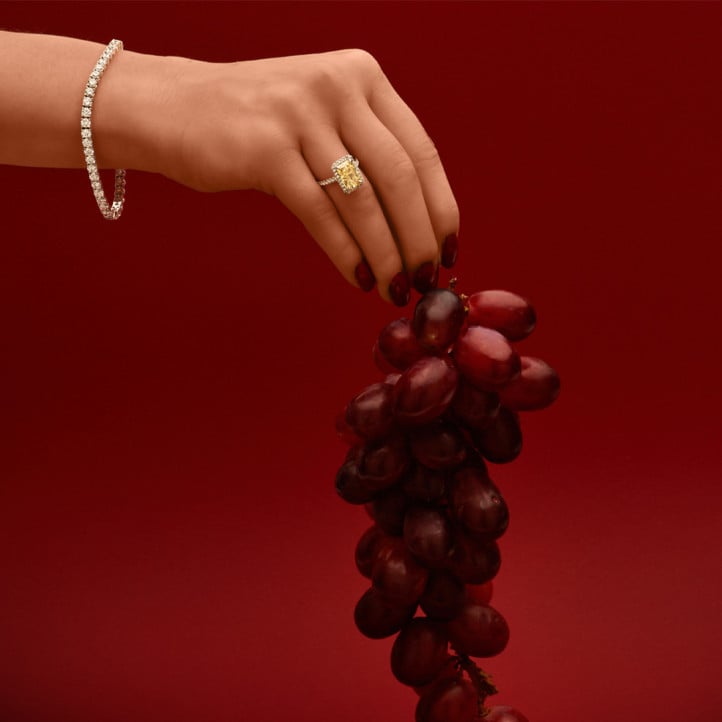 3.00 carat solitaire halo ring with a yellow radiant cut diamond in yellow gold