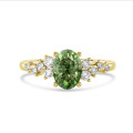 1.00 carat solitaire cluster ring in yellow gold with Fancy Vivid Green oval diamond