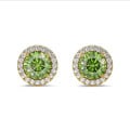 2.00 carat Fancy Vivid Green diamond halo earrings in yellow gold