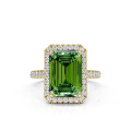 2.00 carat solitaire halo ring with a Fancy Vivid Green emerald cut diamond in yellow gold with side diamonds