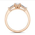 2.00 carat trilogy ring in red gold with lab grown pear diamond and lab grown tapered baguettes