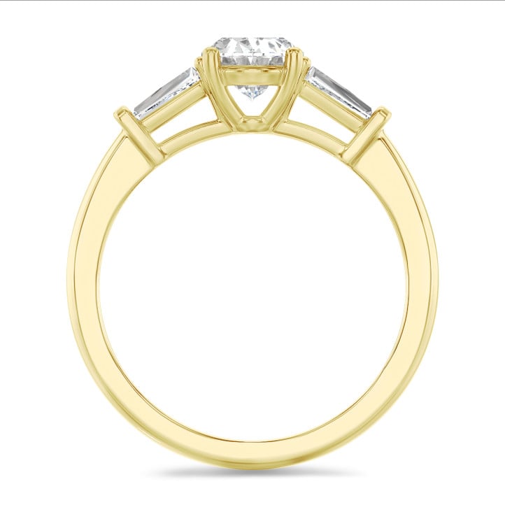 2.00 carat trilogy ring in yellow gold with lab grown oval diamond and lab grown tapered baguettes