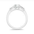 2.00 carat trilogy ring in white gold with round lab grown diamond and lab grown tapered baguettes