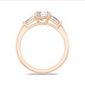 2.00 carat trilogy ring in red gold with round lab grown diamond and lab grown tapered baguettes