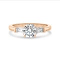 2.00 carat trilogy ring in red gold with round lab grown diamond and lab grown tapered baguettes