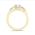 2.00 carat trilogy ring in yellow gold with round lab grown diamond and lab grown tapered baguettes