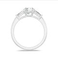 2.00 carat trilogy ring in platinum with round lab grown diamond and lab grown tapered baguettes