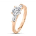 3.00 carat trilogy ring in red gold with a lab grown cushion diamond and lab grown tapered baguettes