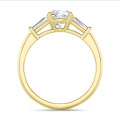 3.00 carat trilogy ring in yellow gold with a lab grown cushion diamond and lab grown tapered baguettes