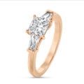 3.00 carat trilogy ring in red gold with a lab grown princess diamond and lab grown tapered baguettes