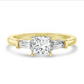 3.00 carat trilogy ring in yellow gold with a lab grown princess diamond and lab grown tapered baguettes