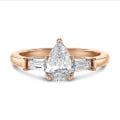 3.00 carat trilogy ring in red gold with lab grown pear diamond and lab grown tapered baguettes