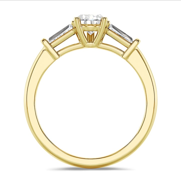 3.00 carat trilogy ring in yellow gold with lab grown pear diamond and lab grown tapered baguettes