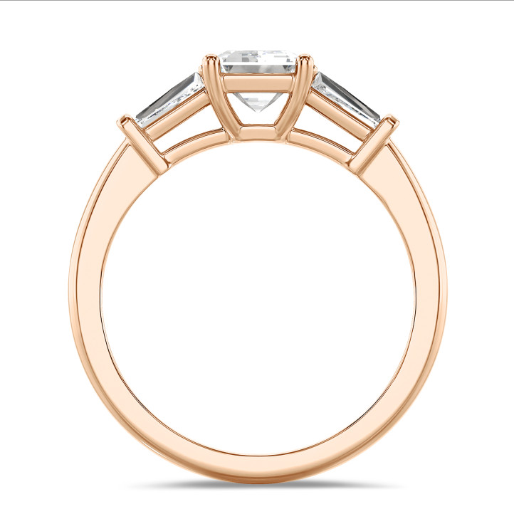 3.00 carat trilogy ring in red gold with a lab grown emerald cut diamond and lab gown tapered baguettes