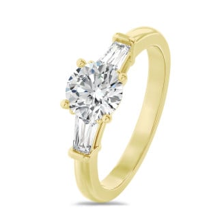 3.00 carat trilogy ring in yellow gold with round lab grown diamond and lab grown tapered baguettes