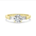 3.00 carat trilogy ring in yellow gold with round lab grown diamond and lab grown tapered baguettes