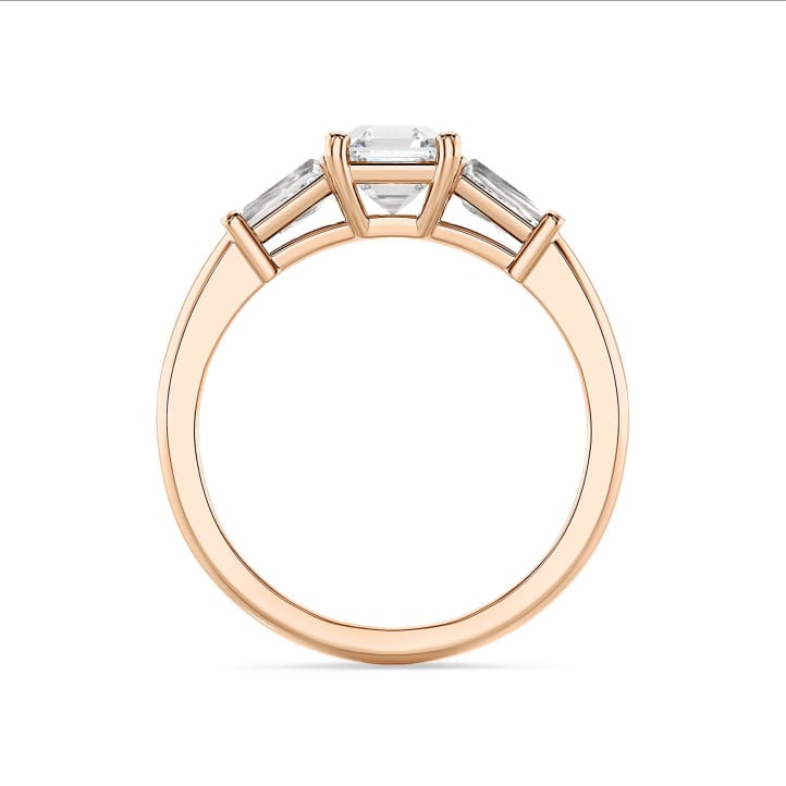 3.00 carat trilogy ring in red gold with a lab grown asscher cut diamond and lab grown tapered baguettes