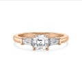 3.00 carat trilogy ring in red gold with a lab grown asscher cut diamond and lab grown tapered baguettes