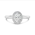 3.00 carats bague solitaire de type auréole avec un diamant de laboratoire ovale en or blanc avec diamants de laboratoire ronds