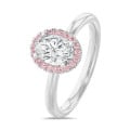 1.00 carats bague solitaire de type auréole avec un diamant ovale en or rouge et diamants ronds roses