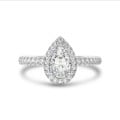 Anello solitario halo da 1,00 carati con diamante pera in oro bianco con diamanti rotondi