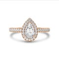 Anello solitario halo da 1,20 carati con diamante pera in oro rosso con diamanti rotondi