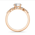 1.50 carat solitaire cluster ring in red gold with a round diamond