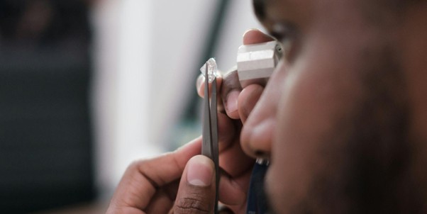 man analysing how pure a lab grown diamond is.