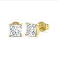 4.00 karaat solitaire oorbellen in geel goud met lab grown princess diamanten