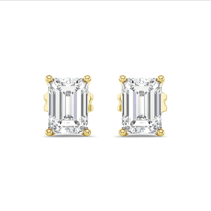 4.00 karaat solitaire oorbellen in geel goud met emerald cut diamanten