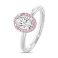 1.50 karaat halo solitaire ring met een ovale lab grown diamant in rood goud met ronde roze lab grown diamanten